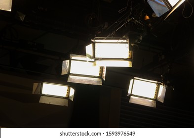 Lights In TV News Studio. Modern Cinema And TV Light Equipment. Sound Stage With A Large Lighting Grid. Production For Entertainment Industry. Lighting Equipment For TV Show.