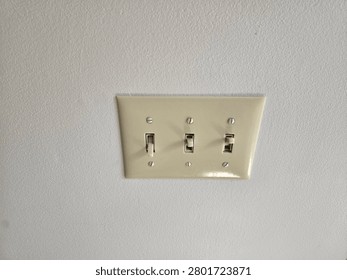 Lightswitch panel with 3 switches.