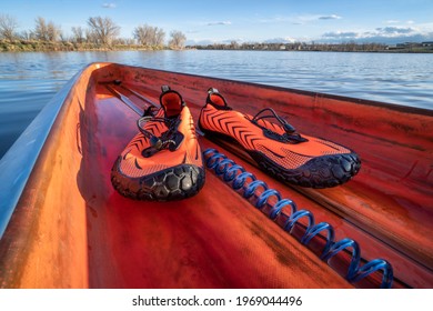 lightweight low-profile water shoes for kayaking and other wet sports on a deck of a stand up paddleboard