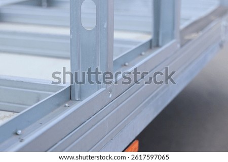 Lightweight steel thin-walled structures. Frameworks for warehouses, garages or houses. Steel frame structure for construction. Selective focus structures