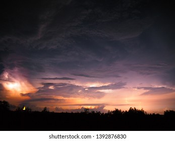 Ligtning between clouds in night.