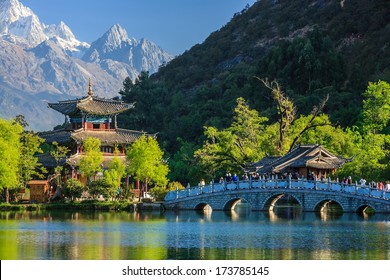 Lijiang Old Town Scene-Black Dragon Pool Park. You Can See Jade Dragon Snow Mountain In The Background.