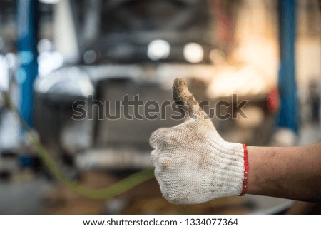 Like created by the hands of a worker with dirty hands. Concept working class, profession Turner, dirty hands, hands in engine oil, car repair, quality machine repair, repair