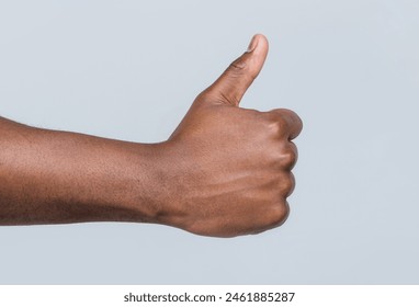 Like gesture. Close-up hand showing thumbs up. Man hands showing thumbs up. Support encourage. African male hand showing thumb up. African american hands showing like. - Powered by Shutterstock