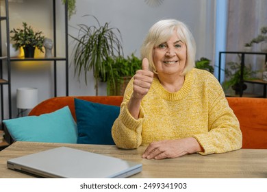 Like. Happy excited senior woman looking approvingly at camera show thumbs up like sign positive something good great news, positive feedback at home indoors. Elderly smiling grandmother sits at table - Powered by Shutterstock