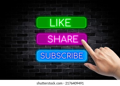 Like, Share, Subscribe neon banner with a hand on a brick wall background.	 - Powered by Shutterstock