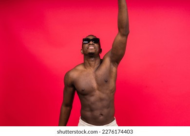 Like what you see. A handsome and muscular young man posing in the studio.