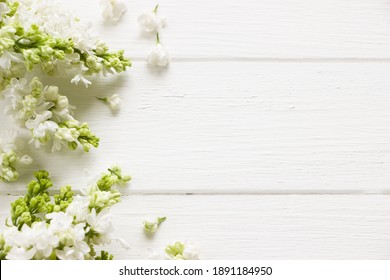 Lilac  Blooming Branches  On White Wooden Board.  Spring Template . Spring Background With Empty Space For Mother's Day, Women's Day, 8 March, Birthday, Easter, Wedding Invitation