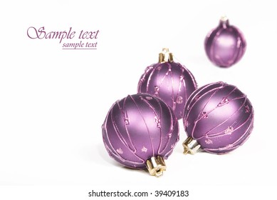 Lilac Christmas Baubles With A White Background With Space For Text