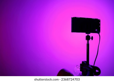 lilac gradient on the surface, light from the LED panel. stage lighting