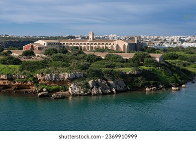 L'Illa del Rei hospital island in the middle of the main navigable entry channel to Mahon in Menorca in the Mediterranean sea
