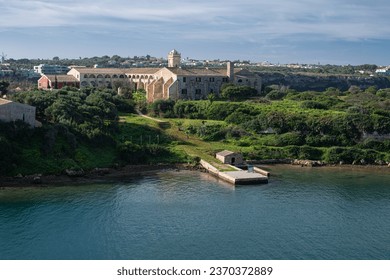 L'Illa del Rei hospital island in the middle of the main navigable entry channel to Mahon in Menorca in the Mediterranean sea