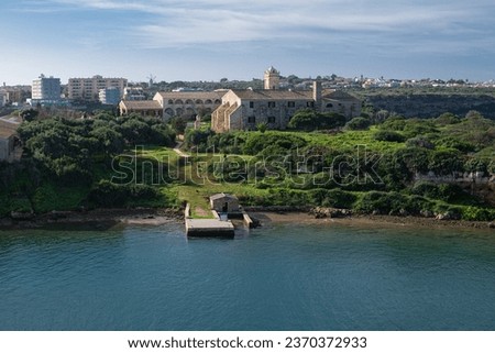 L'Illa del Rei hospital island in the middle of the main navigable entry channel to Mahon in Menorca in the Mediterranean sea
