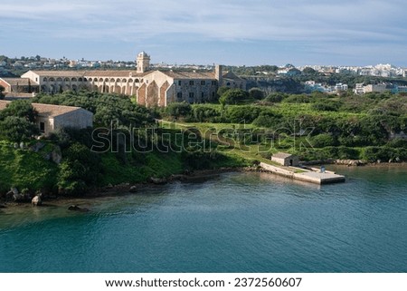 L'Illa del Rei hospital island in the middle of the main navigable entry channel to Mahon in Menorca in the Mediterranean sea