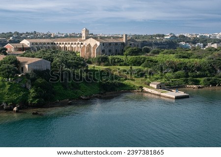 L'Illa del Rei hospital island in the middle of the main navigable entry channel to Mahon in Menorca in the Mediterranean sea