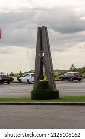 Lillesand, Norway - August 01 2021: A supersized clothespin at a parking lot.
