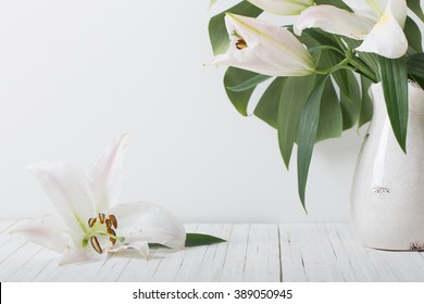 Lily In Jug On White Background