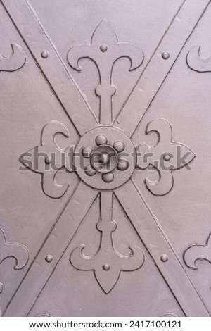 lily motif on wrought iron front door