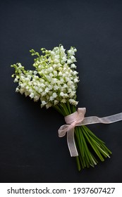 Lilyof The Valley On Black Table. White Spring Flowers