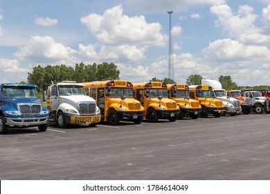 Lima - Circa July 2020: International Semi Tractor Trailer trucks and buses lined up for sale. International is owned by Navistar.