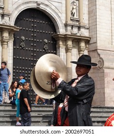 Lima, Peru - 22.03.2020: A man crashing cymbals during a parade in Lima