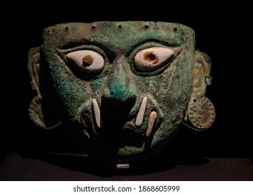 Lima, Peru - April 04, 2015: Ancient, bronze and shell moche mask depicting the hero Ai Apaec, an archaeological artifact of the ancient pre-Inca culture of Mochica.
