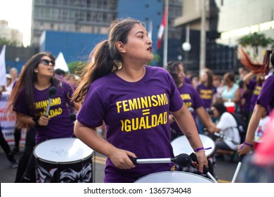 Lima, Peru - March 8 2019: Peruvian Girl Drumming With A Shirt Of Feminism And Equality At Woman's Day March In Lima.