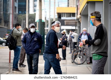 Lima, Peru - May 26 2020: Men In The Streets Wearing Masks And Face Shields Amid Coronavirus Outbreak In South America. COVID-19 Times.