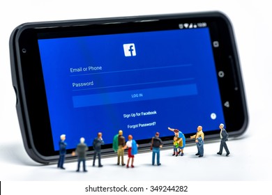 LIMASSOL, CYPRUS - DECEMBER 07, 2015: Group Of People Watching At Facebook Application Sign In Page On Smartphone. Social Networking Concept On December 7, 2015 In Limassol