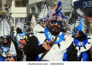 Limassol, Cyprus, March 10th, 2019: Man In A Carnival Costume With A Mohawk Hairstyle Wig Taking Part In The Grand Parade Of The Annual Limassol Carnival Festival 