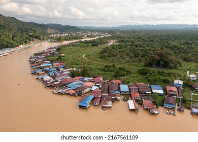 Limbang, Sarawak, Malaysia - June 22 2022: Arial Top Down View Of A Colorful Water Village.