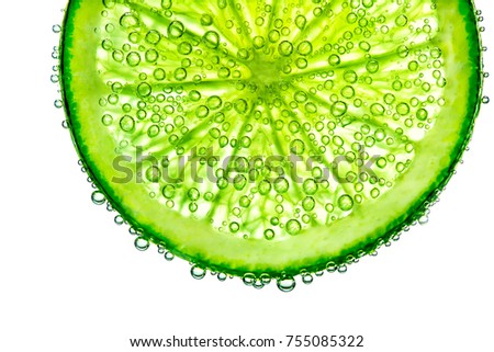 lime with bubbles in water isolated on white background