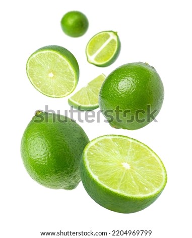 Lime with cut half sliced levitate isolated on white background.