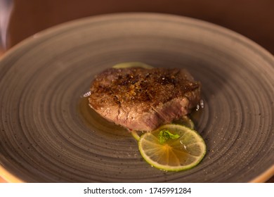 Lime Fillet Gourmet Recipe Resting On A Restaurant Table, No People Are Visible.