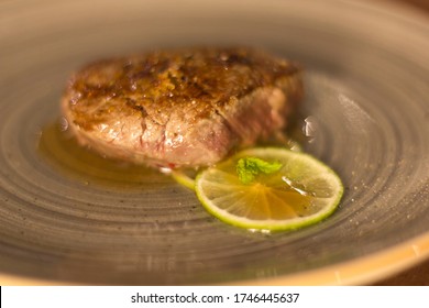 Lime Fillet Gourmet Recipe Resting On A Restaurant Table, No People Are Visible.