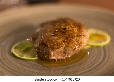 Lime Fillet Gourmet Recipe Resting On A Restaurant Table, No People Are Visible.