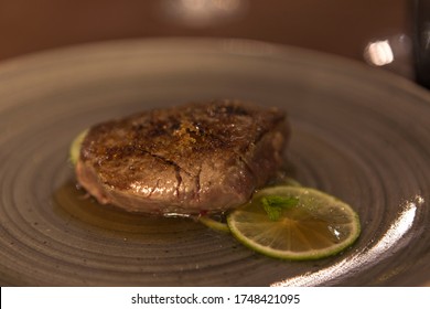 Lime Fillet Gourmet Recipe Resting On A Restaurant Table, No People Are Visible.