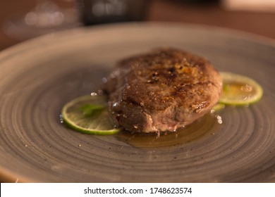 Lime Fillet Gourmet Recipe Resting On A Restaurant Table, No People Are Visible.