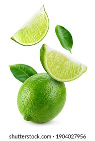 Lime fruit isolate. Falling lime slices with leaves. Flying fruit. Lime whole, half, slice, leaf on white.  Full depth of field. - Shutterstock ID 1904027956