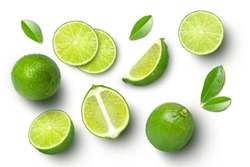 Lime Fruits With Slices And Green Leaves Isolated On White Background. Top View. Flat Lay.