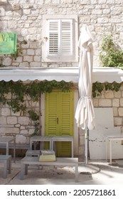 Lime Green Door In Stone Building Facade