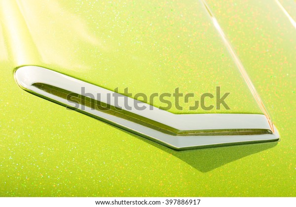 lime green\
glitter covered retro vehicle\
hood
