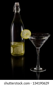 Lime Infused Vodka In A Martini Glass Isolated On A Black Background