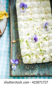 Lime Key Pie From Above, Decorated With Edible Flowers