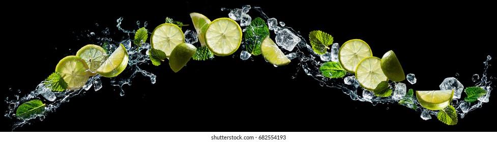 Lime And Lemon Pieces With Mint And Ice In Water Splash