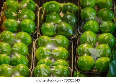 Lime Packing, Wrapping With Cling Wrap In The Pack Of 6, For Sale At A Fruit Market.