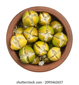 Lime Pickles In A Pot, Lime Preserving Process With Salt, Closeup View Taken From Above, Isolated On White