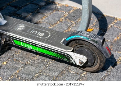 Lime Sign On Standing Deck Of Weathered Electric Rideshare Scooter - San Francisco, California, USA - 2021