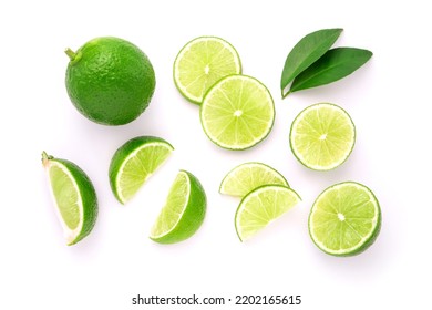 Lime with sliced and green leaf isolated on white background , top view , flat lay.