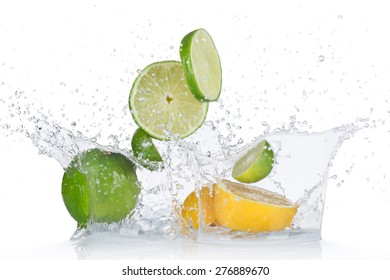 Limes and lemons with water splash isolated on white